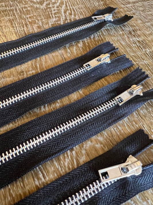 Closed End Metal Zippers on Black Tape