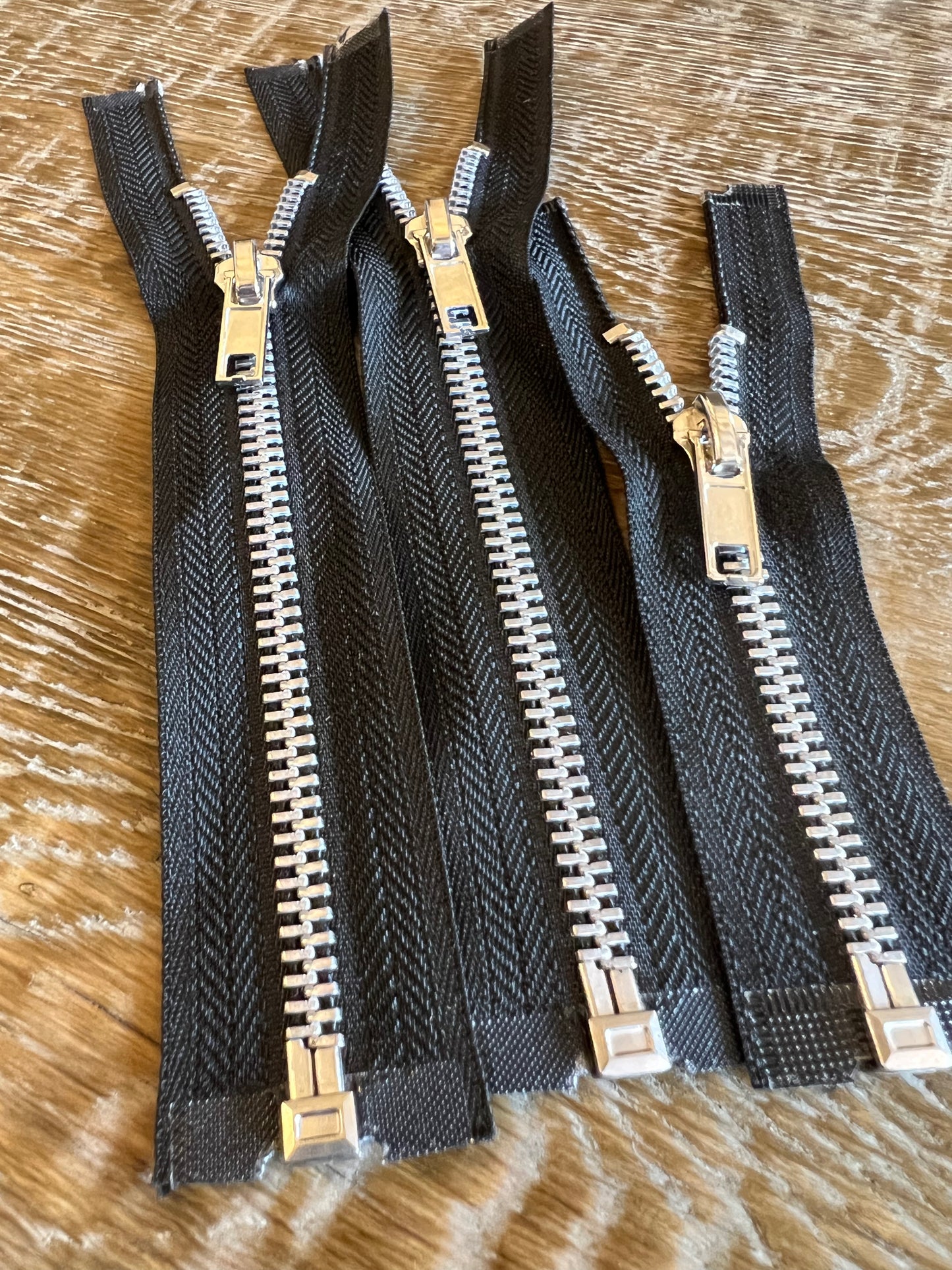 Open End Metal Zippers on Black Tape